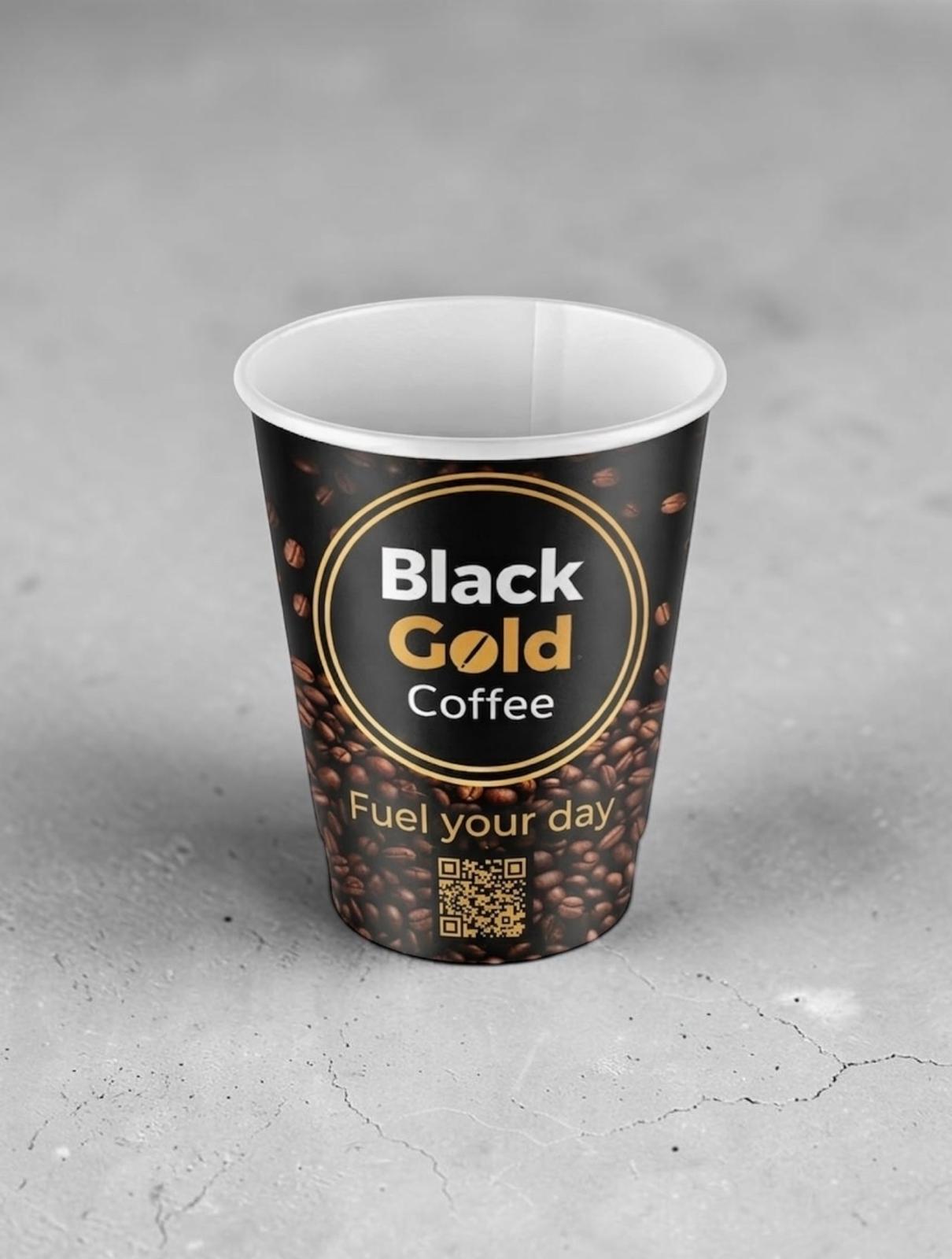 Branded Black Gold Coffee takeaway cup.